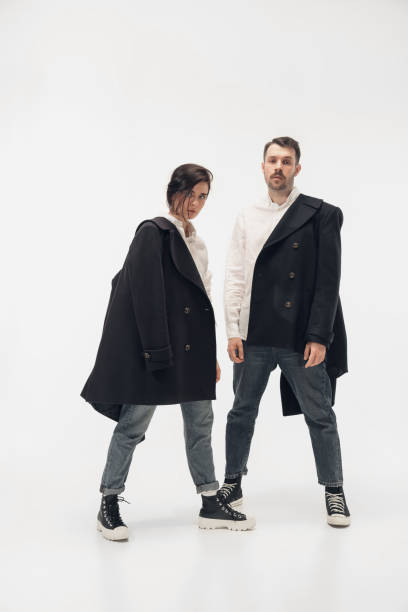istock Trendy fashionable couple isolated on white studio background 1210343198