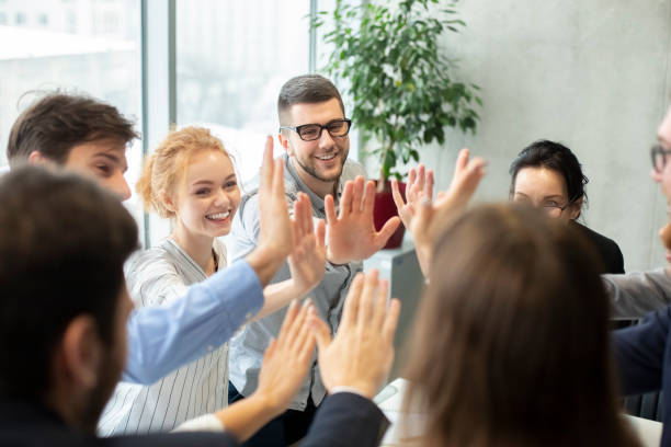 istock Team inspiration concept. Colleagues giving high five 1210351196