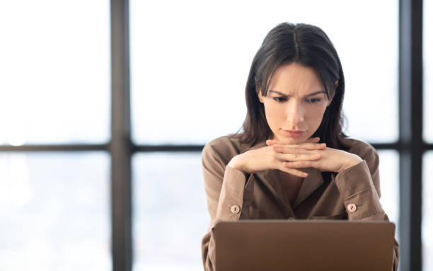 istock European manager sitting at desktop at modern office 1210351287