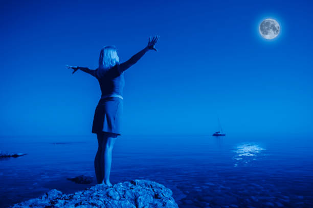 istock Rear view unidentified young happy woman in night 1210351745
