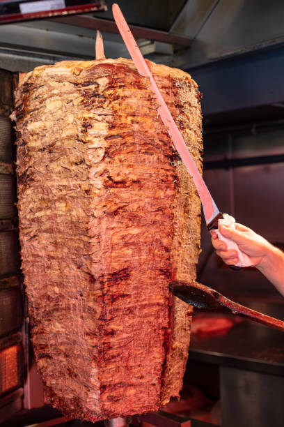 istock Turkish dish Doner Kebab as a turning roast 1210351770