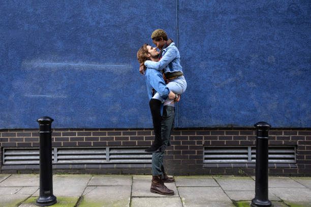 istock Young couple portrait against a deep blue wall 1210351990