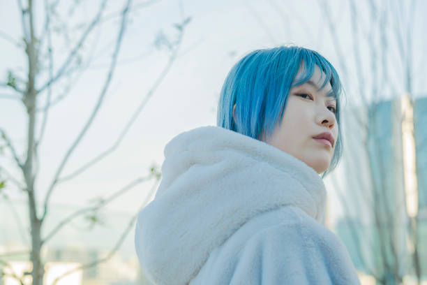 istock young woman with blue hair 1210353225