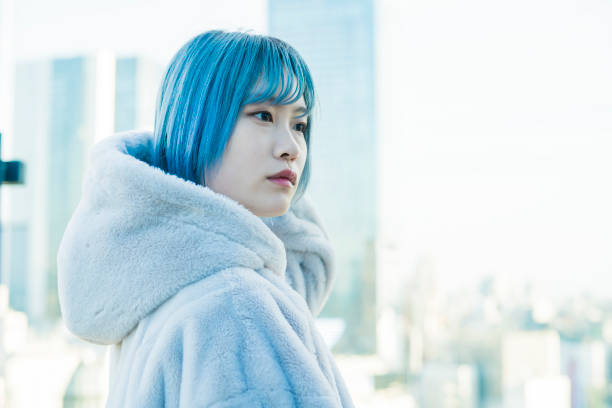 istock young woman with blue hair 1210353253