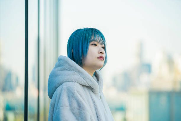 istock young woman with blue hair 1210353259