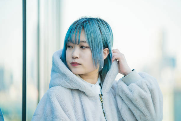 istock young woman with blue hair 1210353271