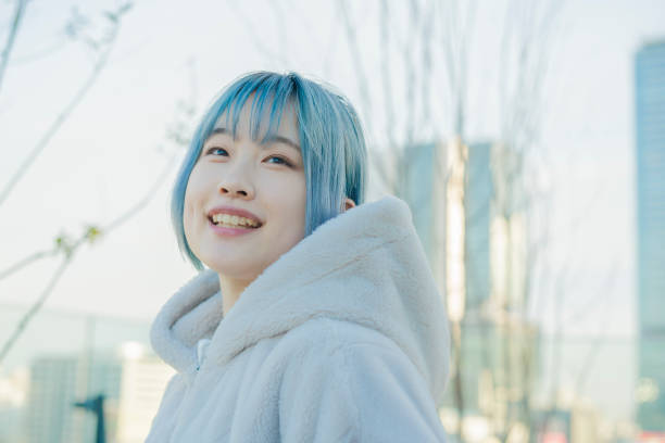 istock young woman with blue hair 1210353302