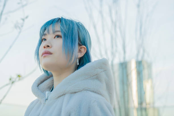 istock young woman with blue hair 1210353324