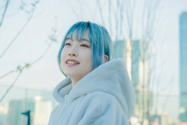 istock young woman with blue hair 1210353341
