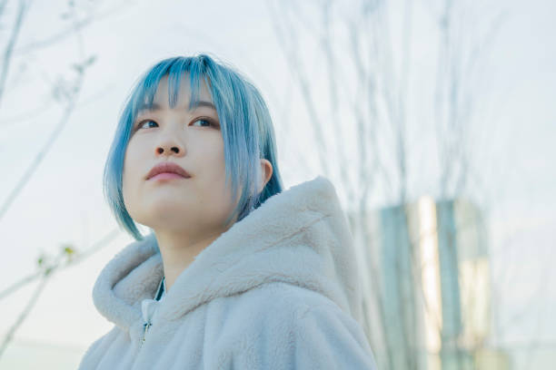 istock young woman with blue hair 1210353353