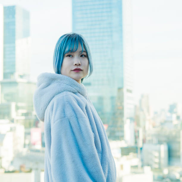 istock young woman with blue hair 1210353356