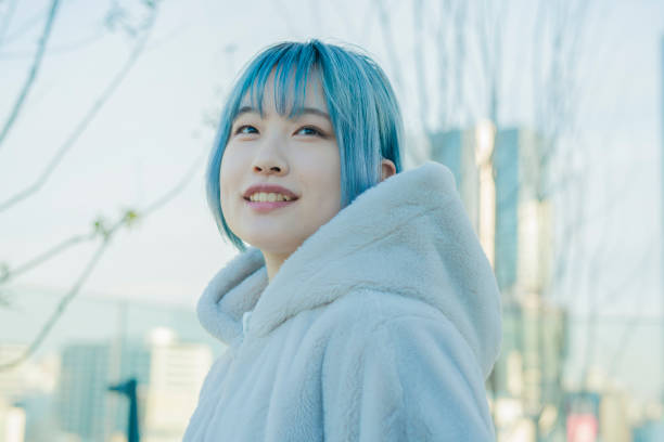 istock young woman with blue hair 1210353357