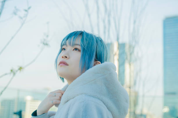 istock young woman with blue hair 1210353377