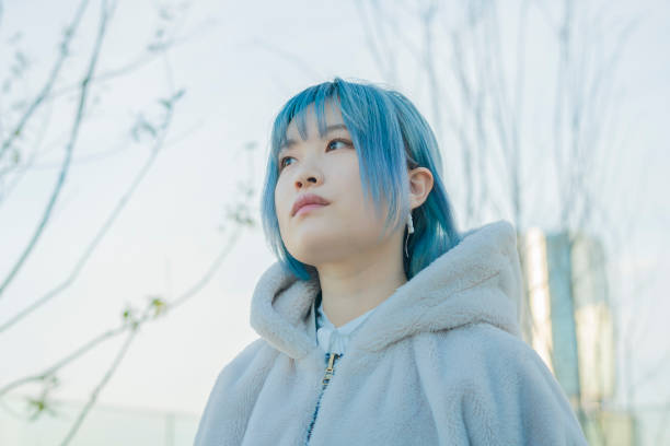 istock young woman with blue hair 1210353392