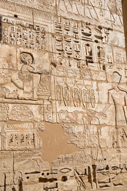 istock Hieroglyphic carvings on an ancient egyptian temple wall 1210353396