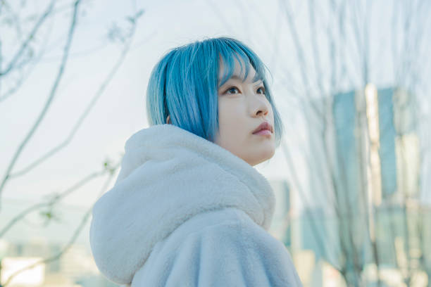 istock young woman with blue hair 1210353397