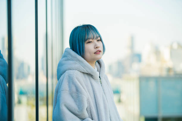istock young woman with blue hair 1210353401
