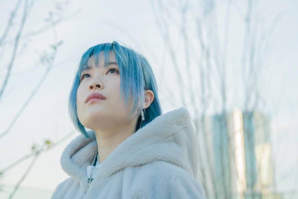 istock young woman with blue hair 1210353409