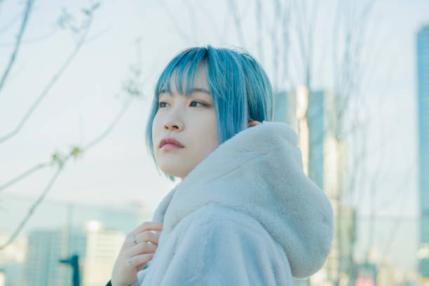 istock young woman with blue hair 1210353416