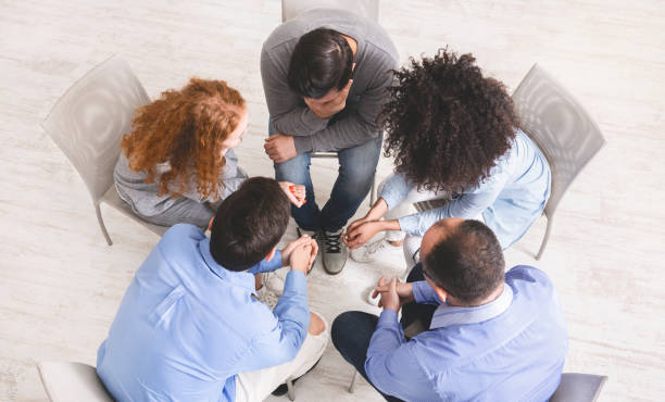 istock People Sitting In Circle Discussing Their Mental Problems With Each Other 1210353590