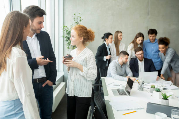 istock Young businesspeople sharing ideas and having friendly conversation 1210353623