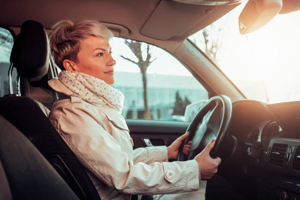 istock Smiling woman in a car 1210355602