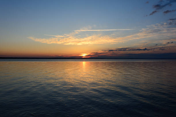 istock Sunset on the lake in the summer 1210355729