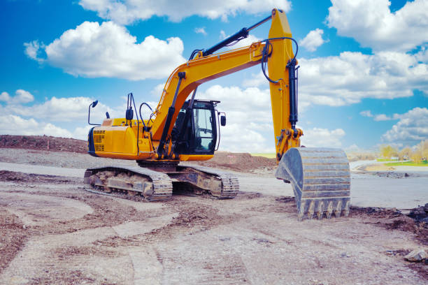 istock excavator at a street construction site on the countryside 1210357086
