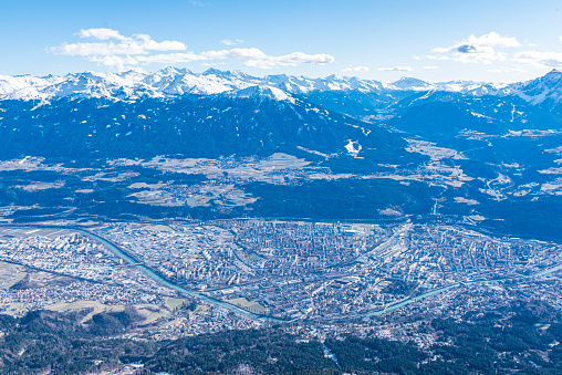 Aerial view of Innsbruck city in Austria. Located in the Inn valley in the Austrian Alps and capital of Tyrol,  it is one of the most important winter sports city in the world.
