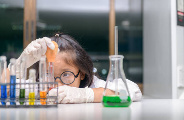 istock Little scientist use dropper to making experiment 1210359482