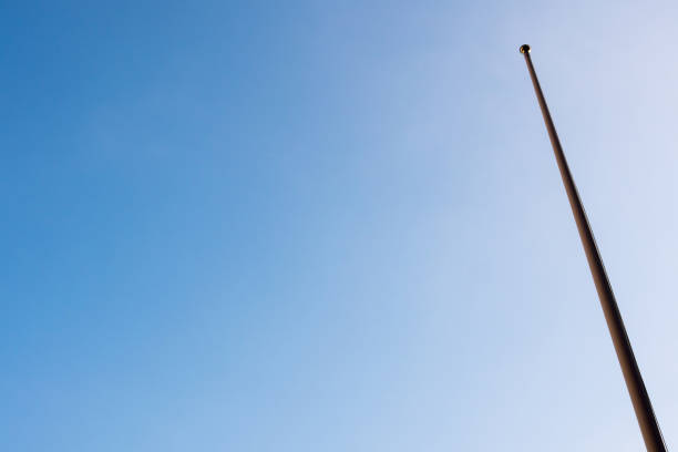 Flagpole is not a flag and clear blue sky