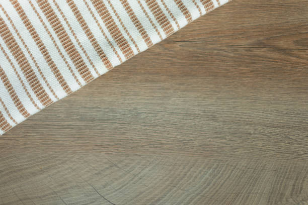 istock Wooden background with striped towel 1210359857