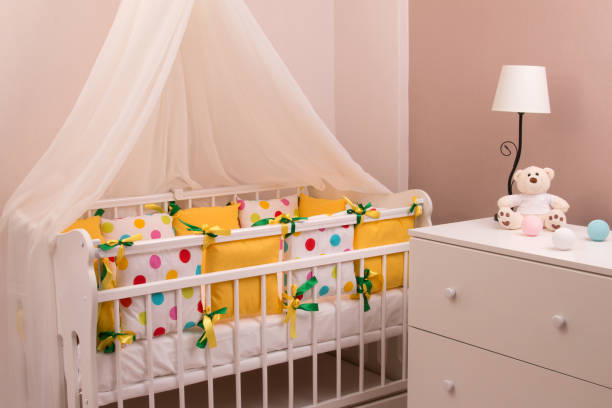 istock Crib with soft sides of pillows. 1210361243