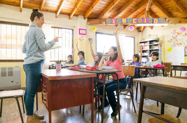 Teacher teaching children the values stock photo