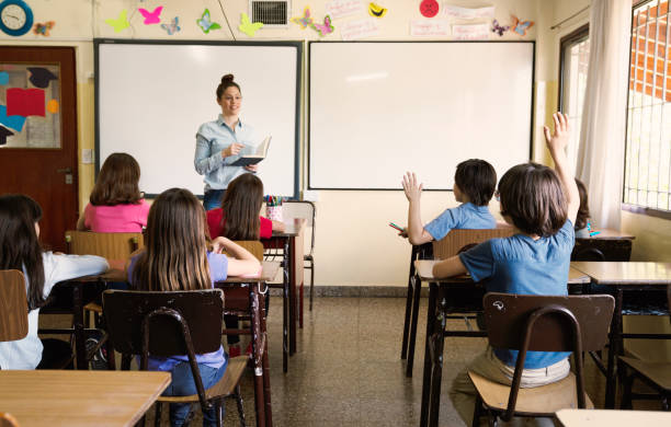 istock Teacher teaching children the values 1210362823