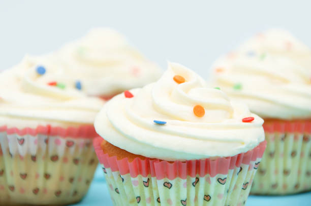 istock Cupcakes closeup with white custard and and confectionery powder 1210363038