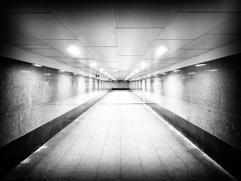 Long underground passage with bright lights