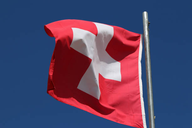 istock Swiss Flag waving in the Wind 1210364415