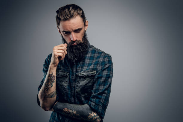 istock Portrait of dolorous bearded man at studio 1210367821