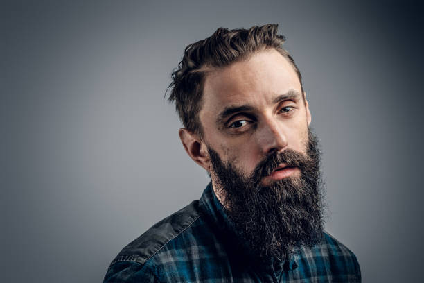 istock Portrait of dolorous bearded man at studio 1210368160
