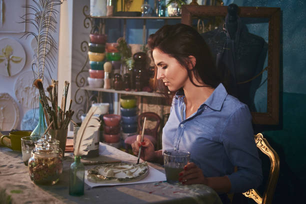 istock Beautiful lady is working on her new masterpiece 1210369111
