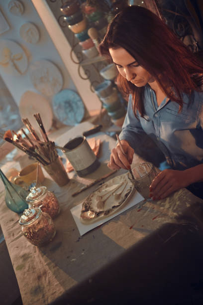 istock Beautiful lady is working on her new masterpiece 1210369180