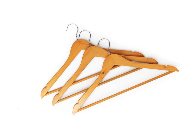 istock Three wooden hanger isolated on a white Background 1210371870