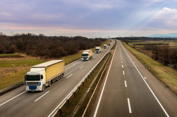 istock Convoy of transportation trucks on a highway 1210374731