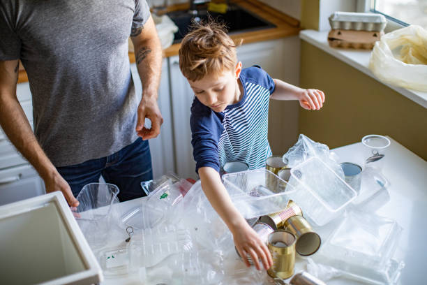 istock Father and son sorting waste at home 1210374959