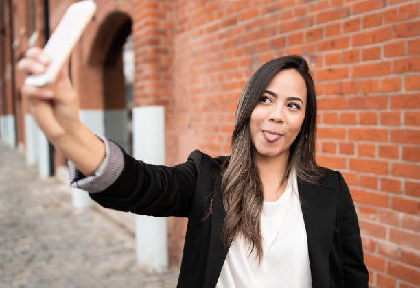 istock Young woman taking selfies with phone. 1210375214