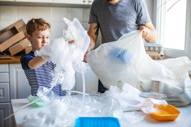 istock Father and son sorting waste at home 1210376005