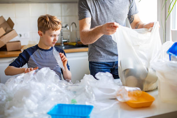 istock Father and son sorting waste at home 1210376006