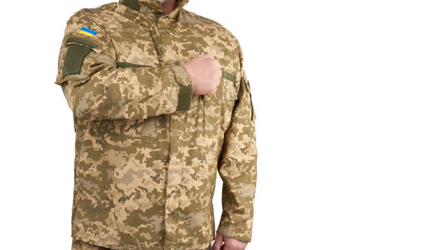 istock Ukrainian man warrior dressed in a military pixel uniform stands on a white background 1210376141