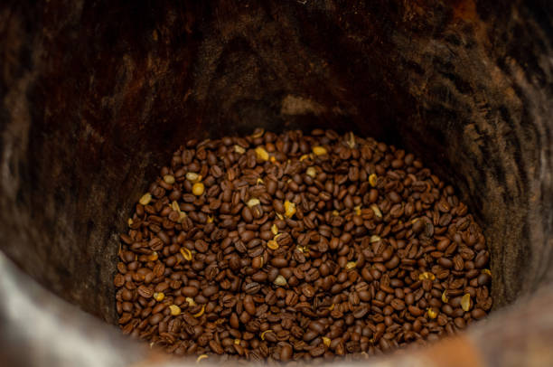 istock Coffee beans freshly toasted on a wodden basket 1210376336
